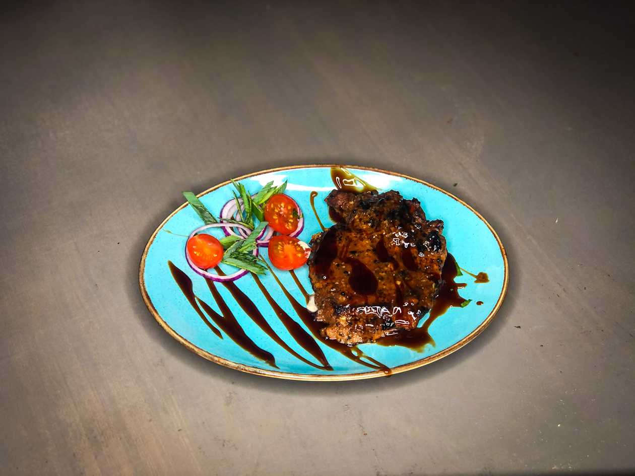 Grilled pork chop with bone