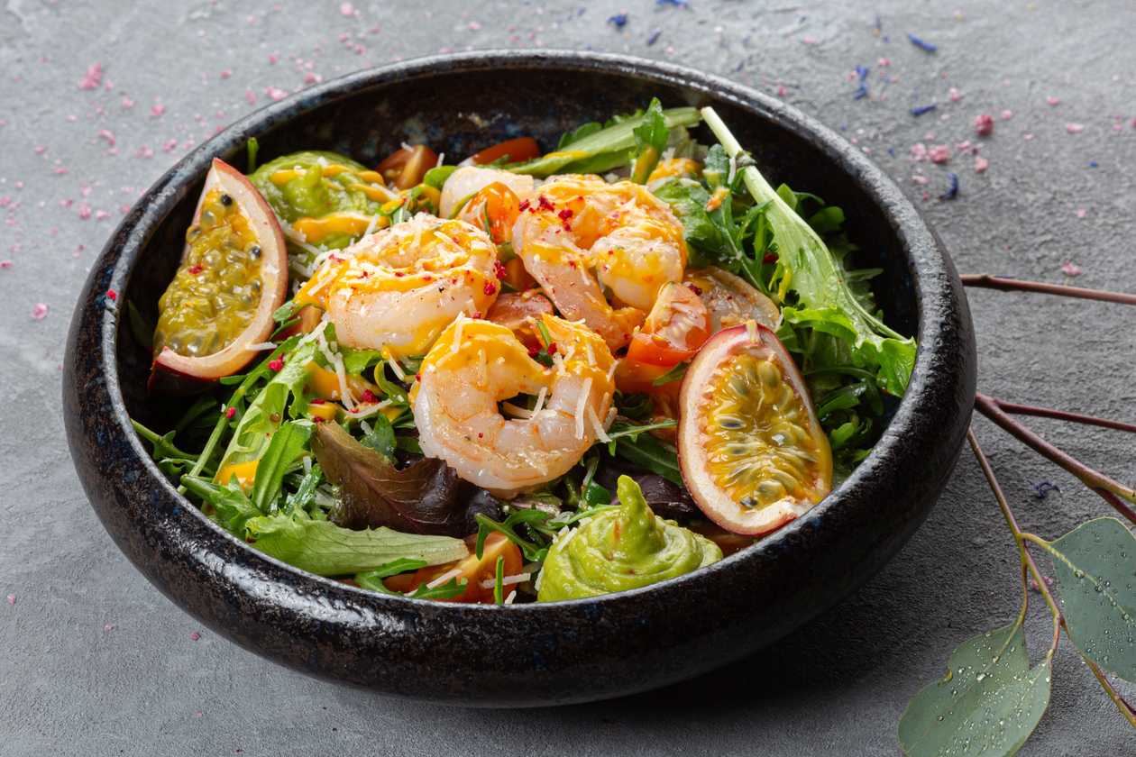 Fresh salad with tiger prawns, guacamole