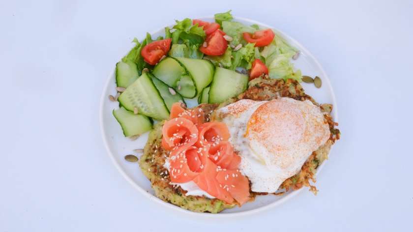 Zucchini pancakes with salmon and poached egg