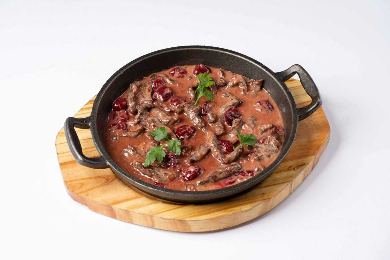 Beef with cherries in sour cream sauce