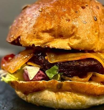 Cheesy burger with wedges and parmesan