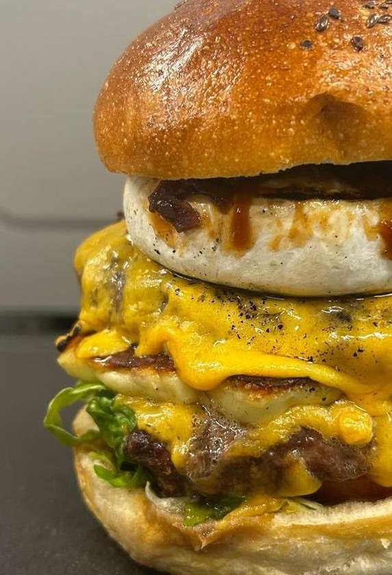Double hyped burger with baked potato and parmesan
