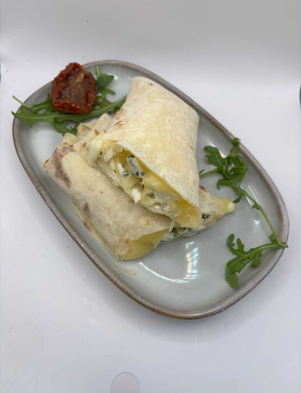 Potato pancake with buffalo mozzarella, edam and blue cheese