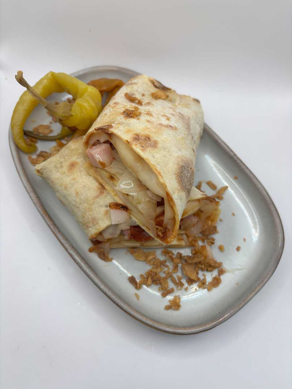 Lokše with BBQ sauce, smoked cheese, bacon and onion