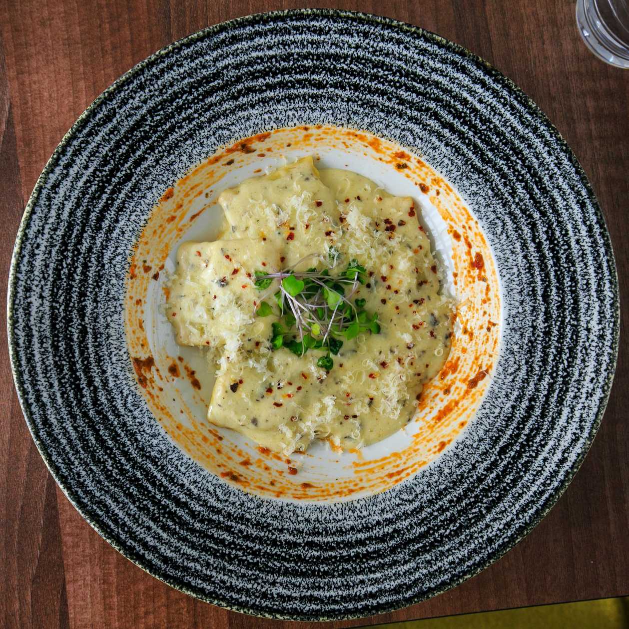 Homemade ravioli stuffed with truffle cream