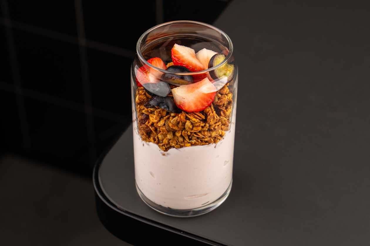 Granola with raspberry yogurt and berries