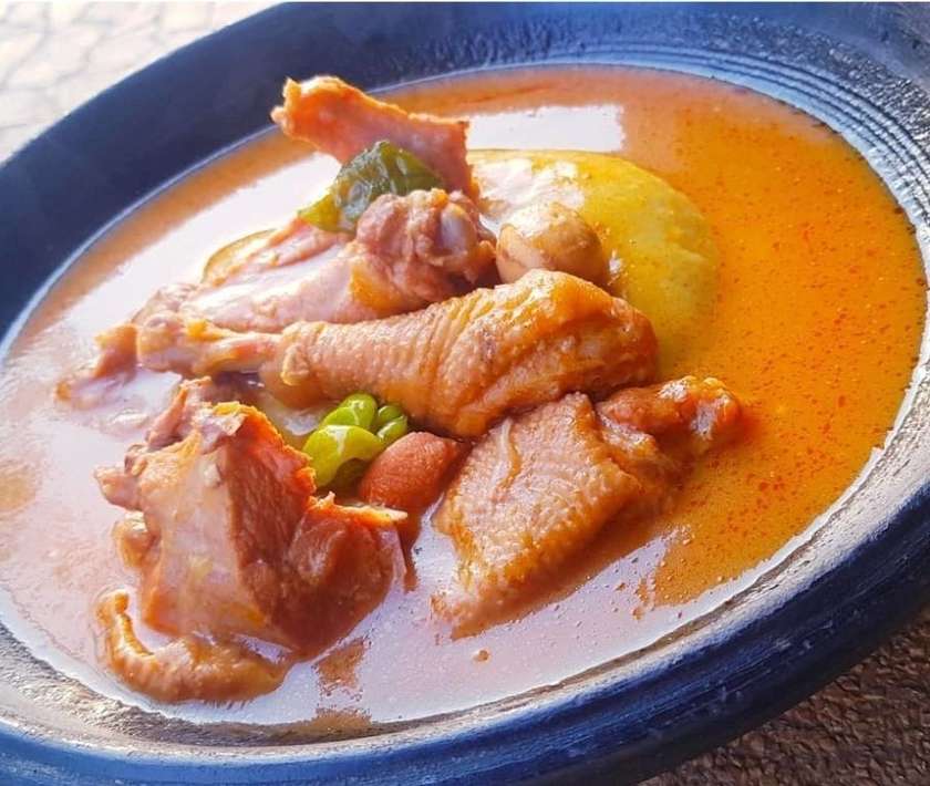 Fufu with Live chicken light soup