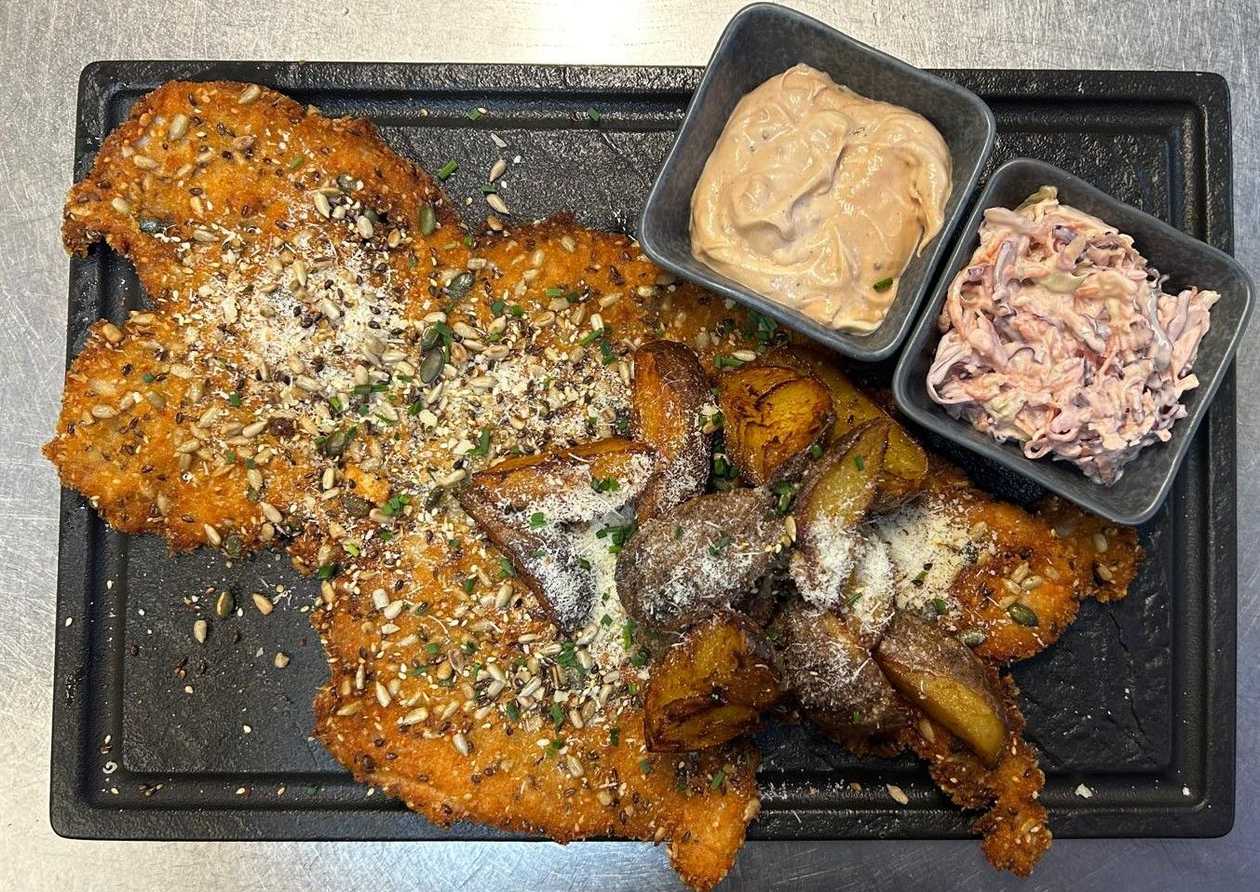 Panko-crusted turkey breast, seed and parmesan mix, potatoes wedges, coleslaw salad