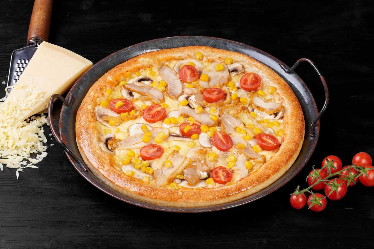 With chicken thick-crust pizza