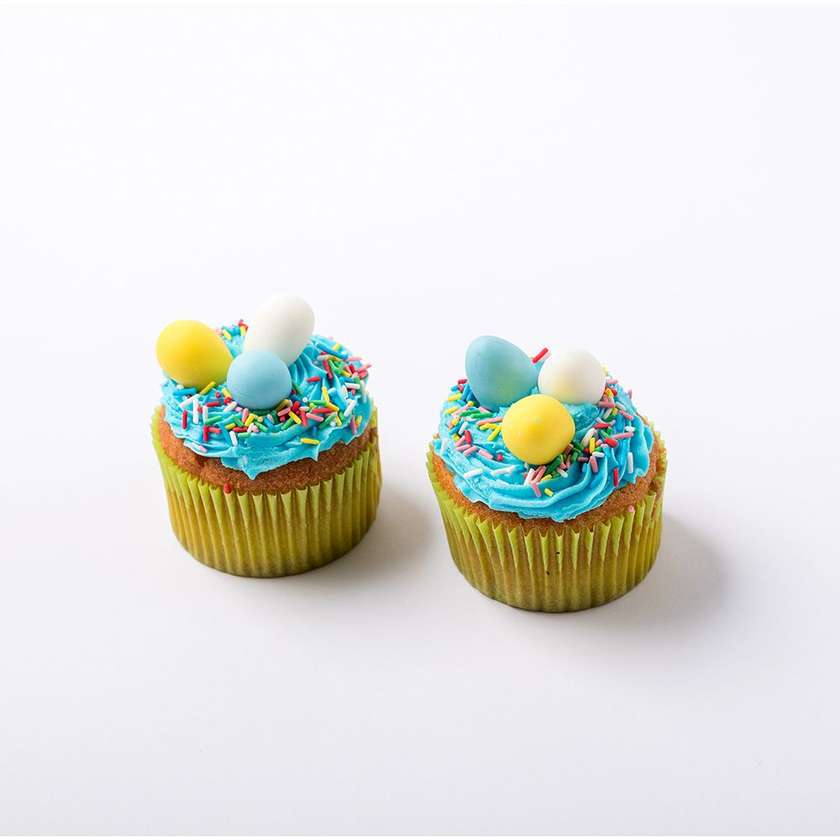 Coloured Eggs on Blue Cupcakes