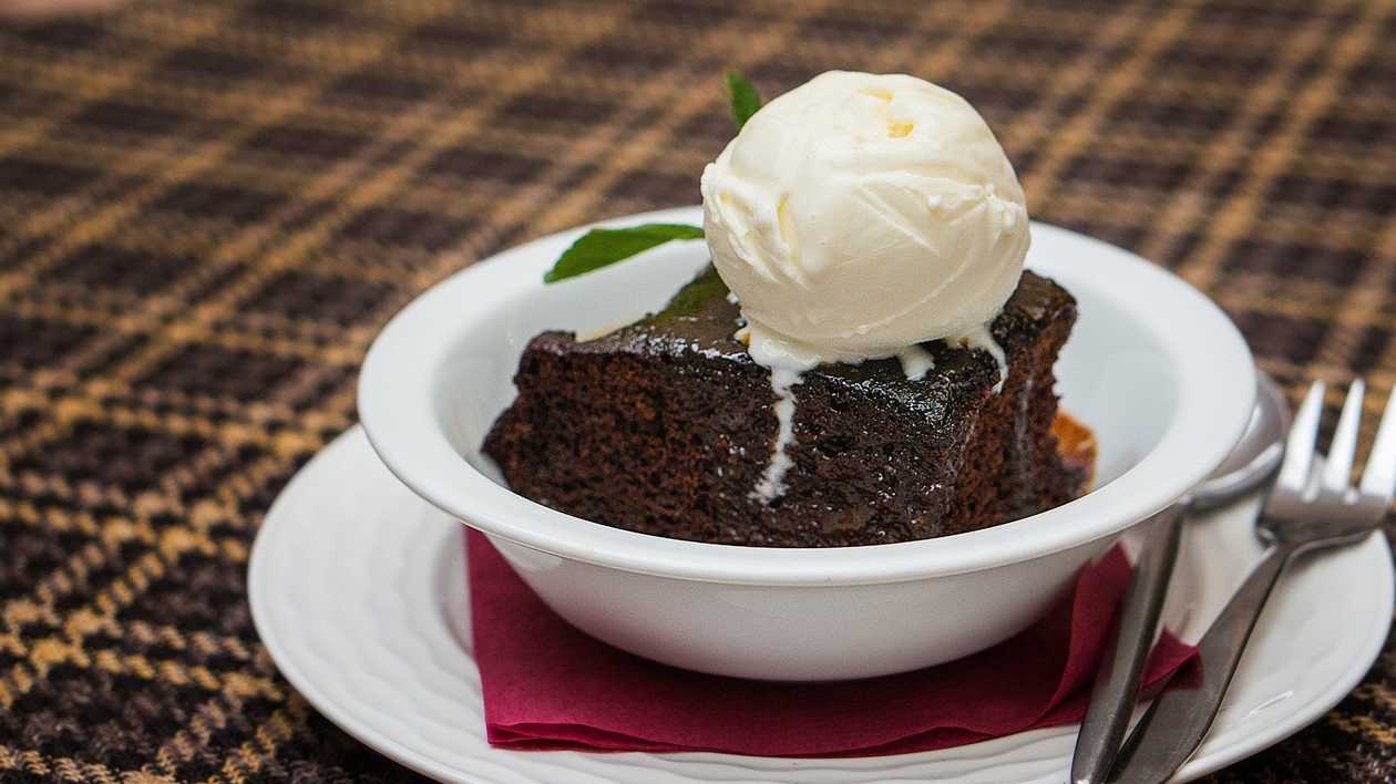 Date cake with caramel sauce