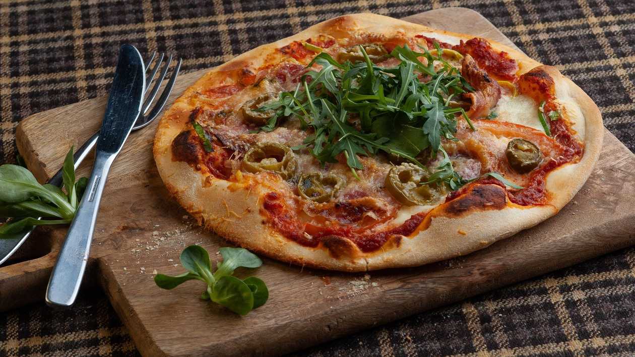 Pizza with Italian cured bacon Pancetta
