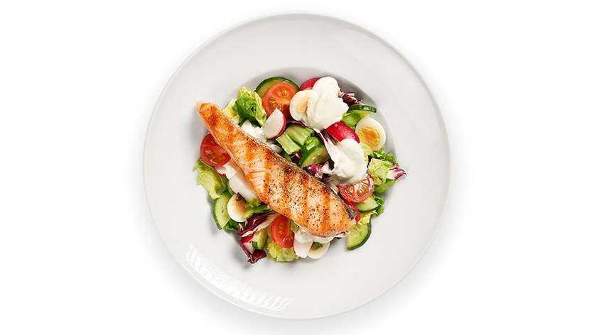 Green salad with goat cheese cream, and fried salmon