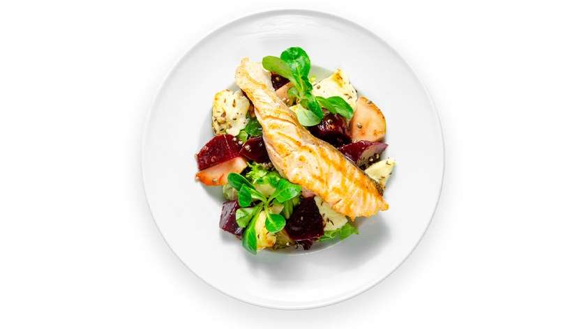 Lithuanian baked curd cheese, beet salad, and fried salmon