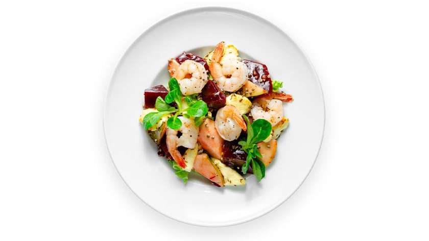 Lithuanian baked curd cheese, beet salad, and fried prawns