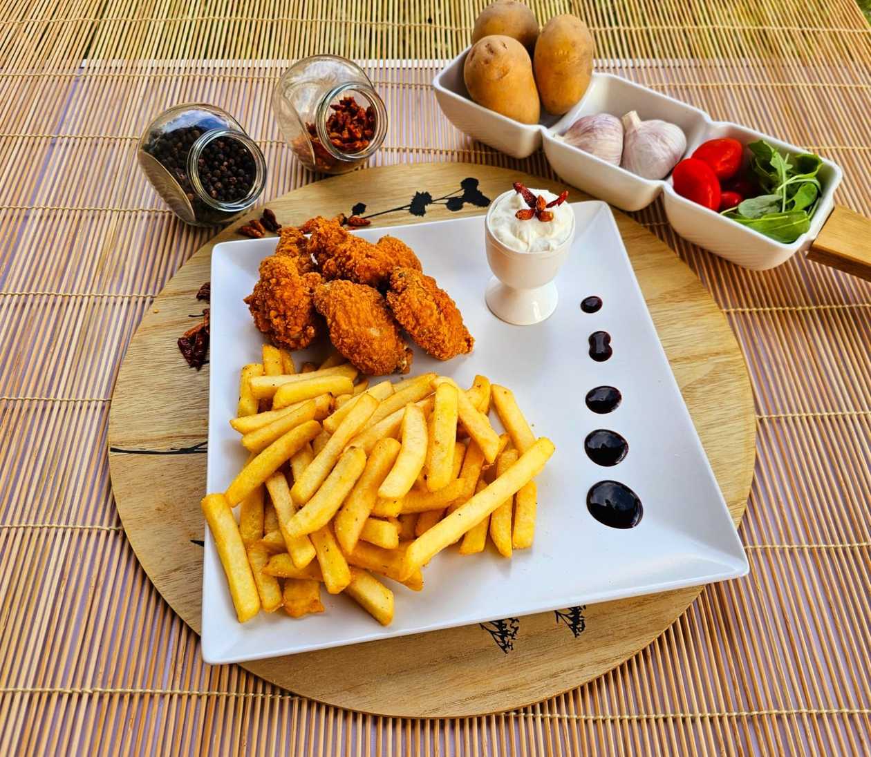 Spicy Chicken Wings with French Fries and Garlic Sauce