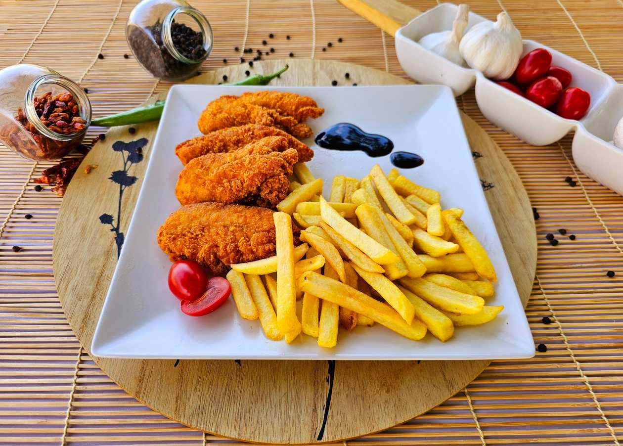 Spicy Crispy Strips with French Fries and Garlic Sauce