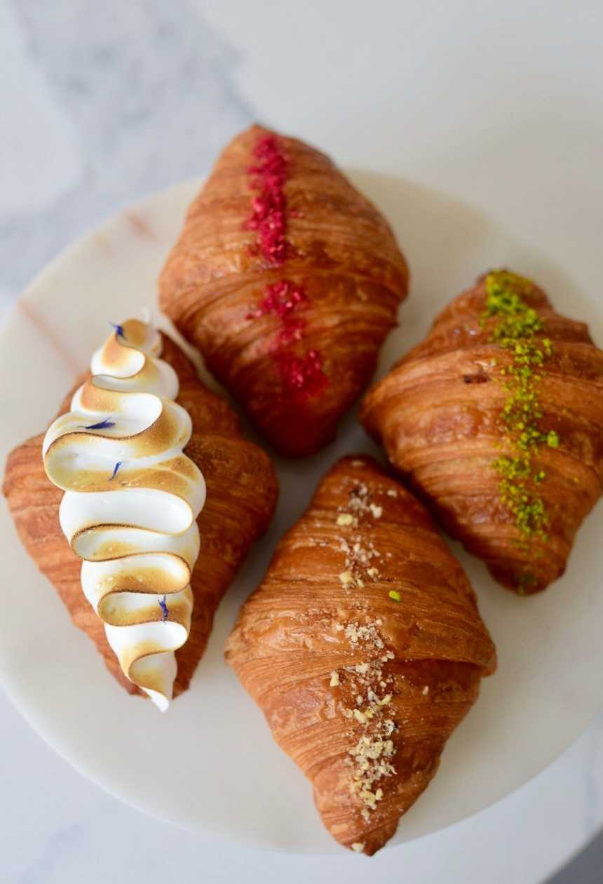 Set of four fresh different croissants
