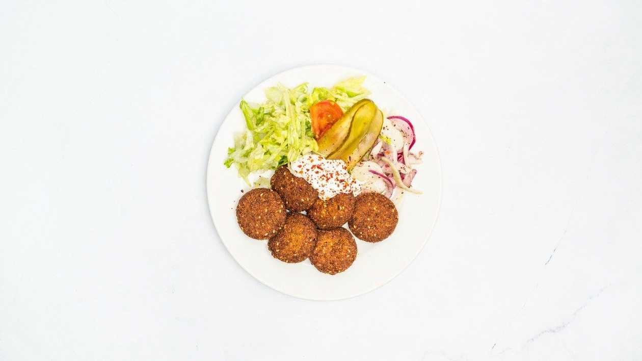 Falafel on a plate with fresh vegetables