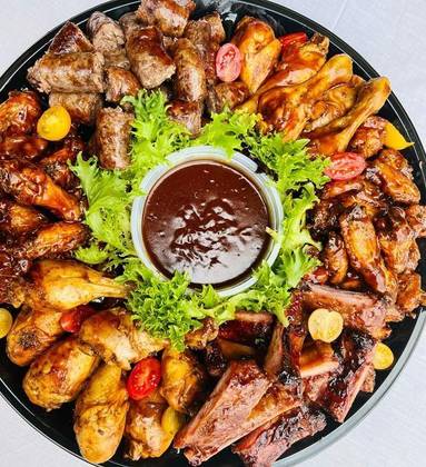 Meat Platter ( grilled chicken pieces , sausages , goat chops and coated fish )