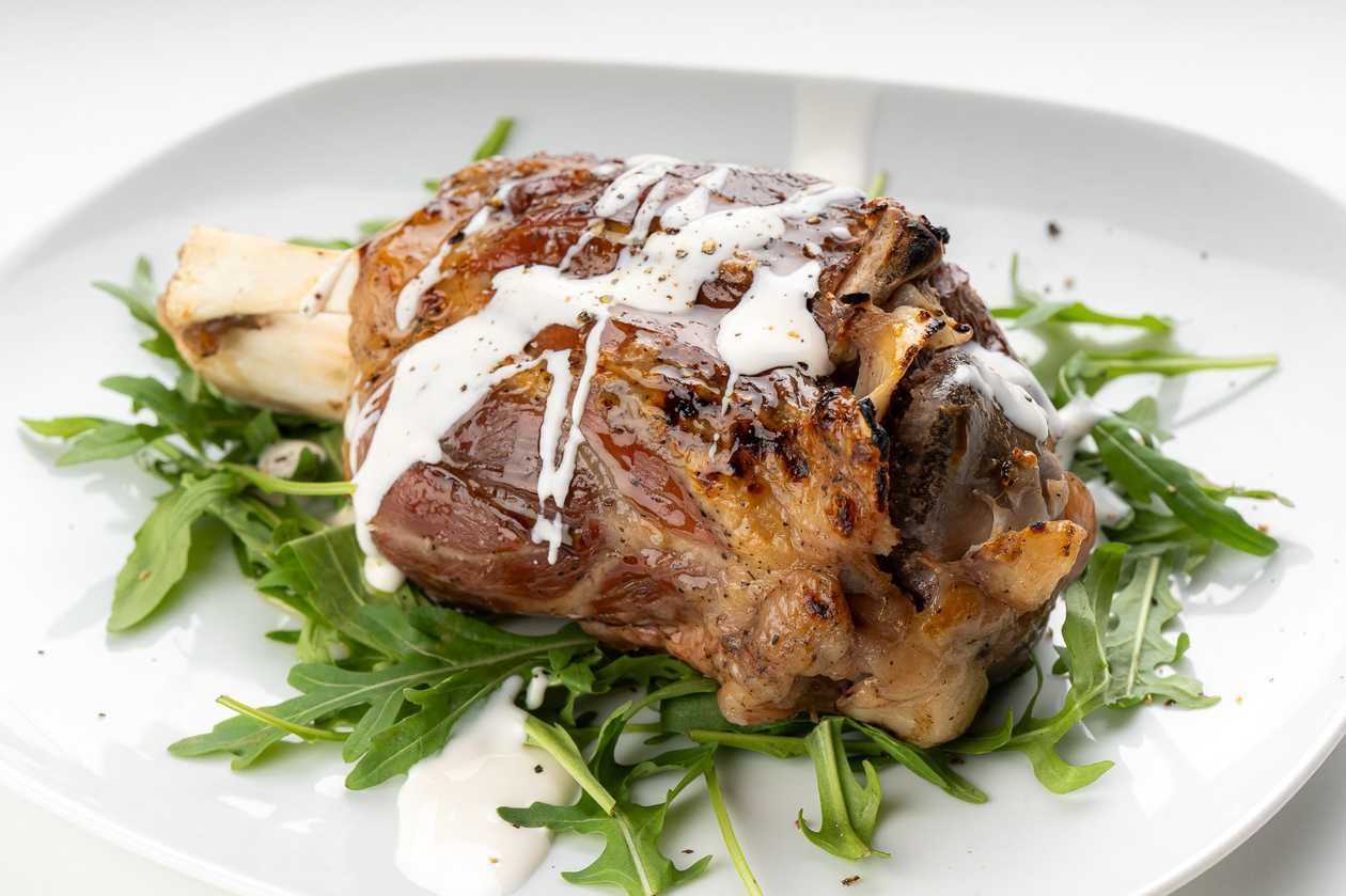 Pork knuckle with sour cream sauce