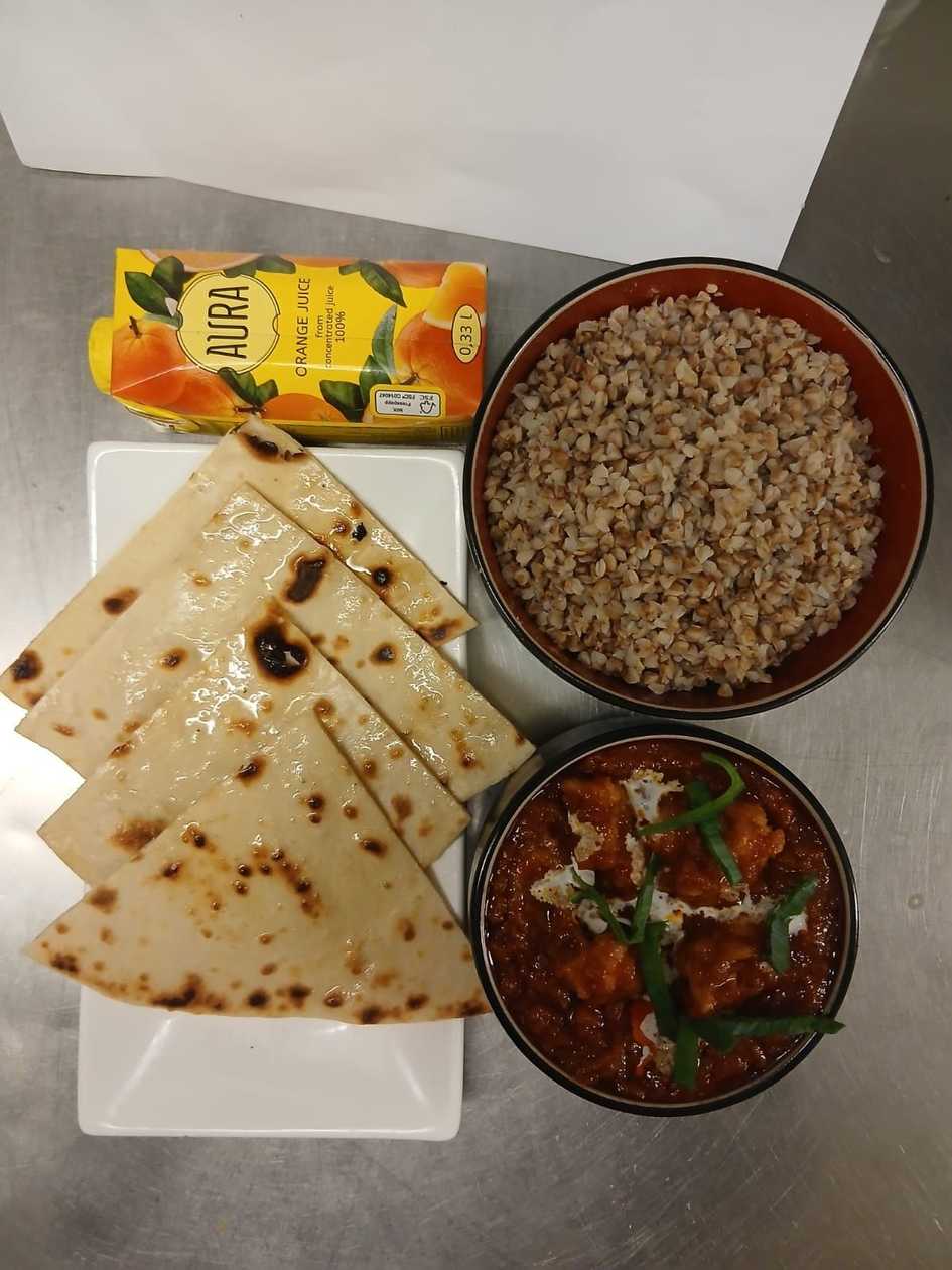 Chicken masala + boiled buck wheat + onion cheese garlic naan + orange juice 0.33l
