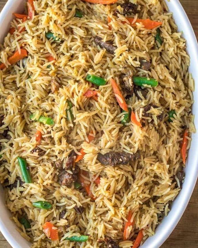 Daloo special fried rice ( assorted meat mixed with vegetables and jollof rice )