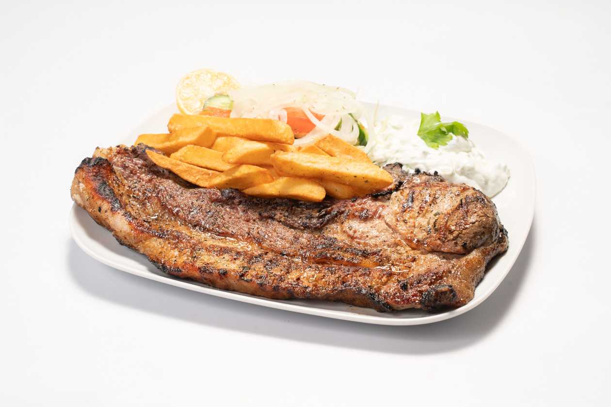 Jumbo Pork Chop with Potatoes and Salad