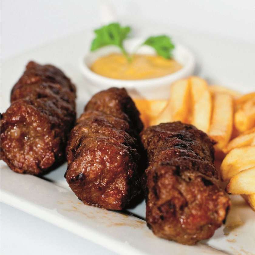 Grilled minced meat rolls with French fries