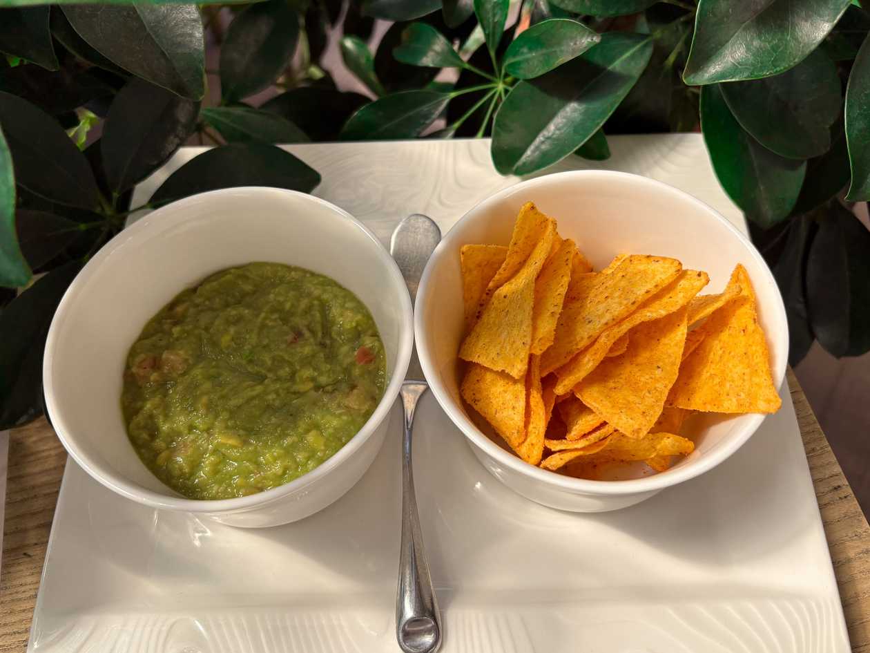 Guacamole with chili peppers and nachos