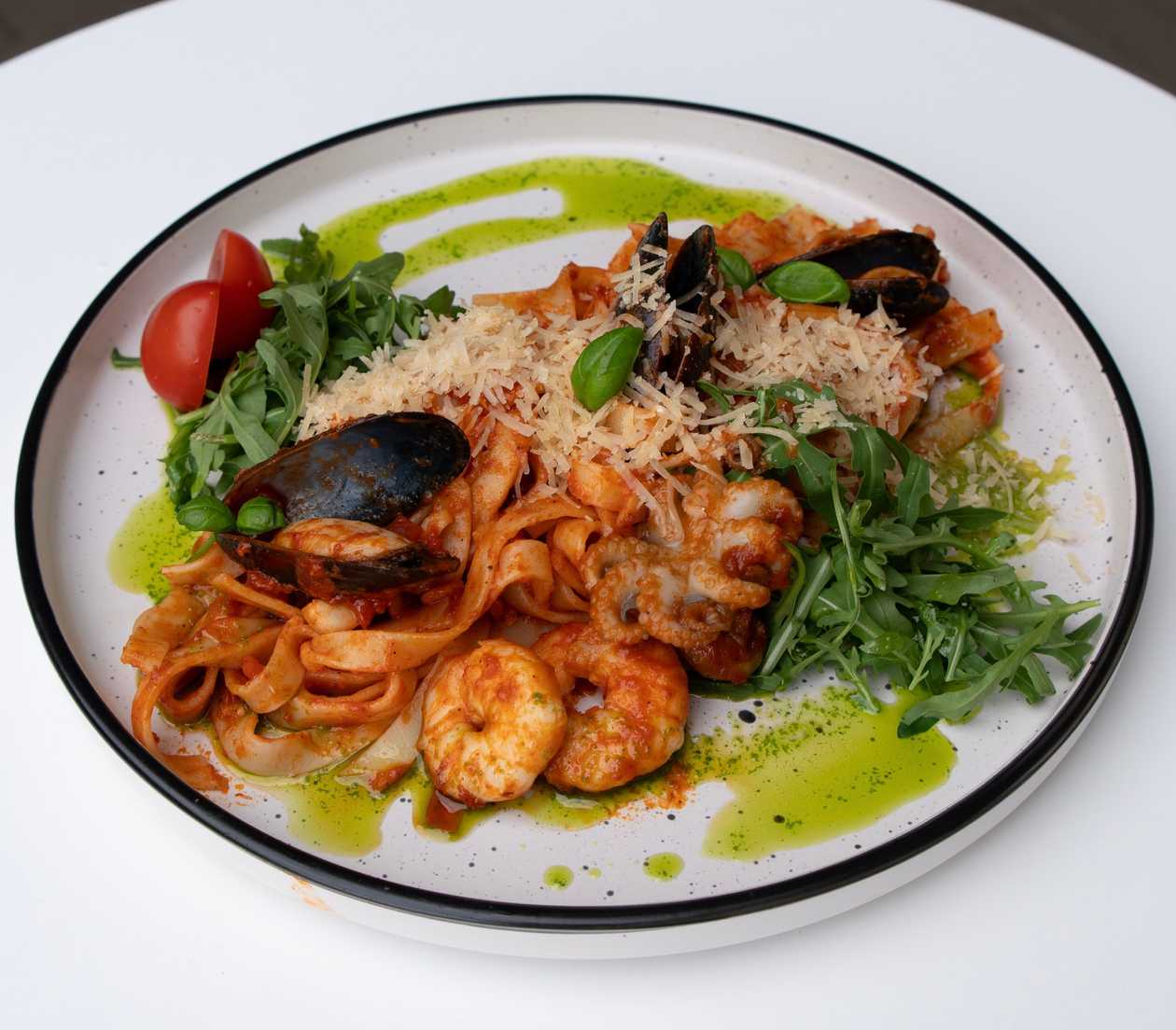 Pappardelle with seafood in tomato sauce