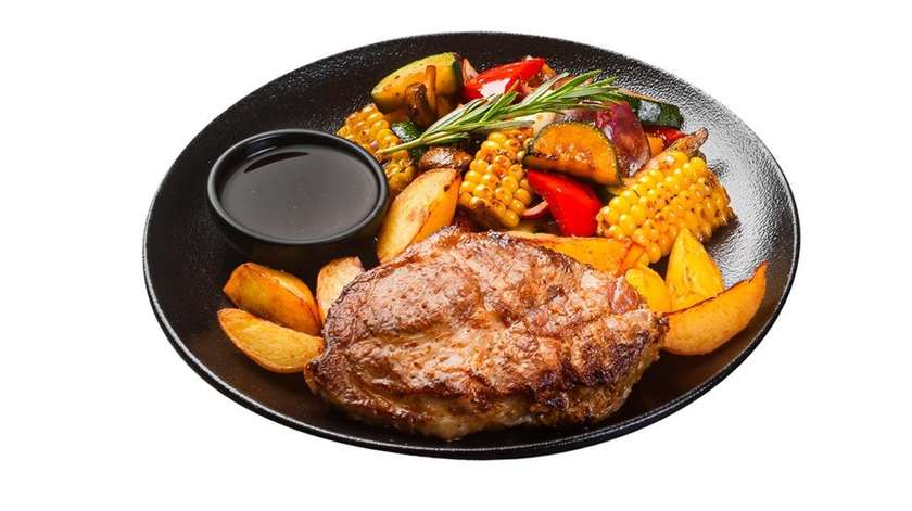 Grilled pork neck steak marinated in wine