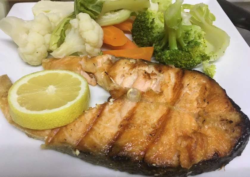 Octopus with olive oil and crushed potatoes and salad