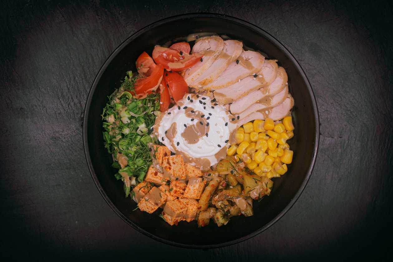Spicy Bowl with Chicken, Tofu, and Vegetables