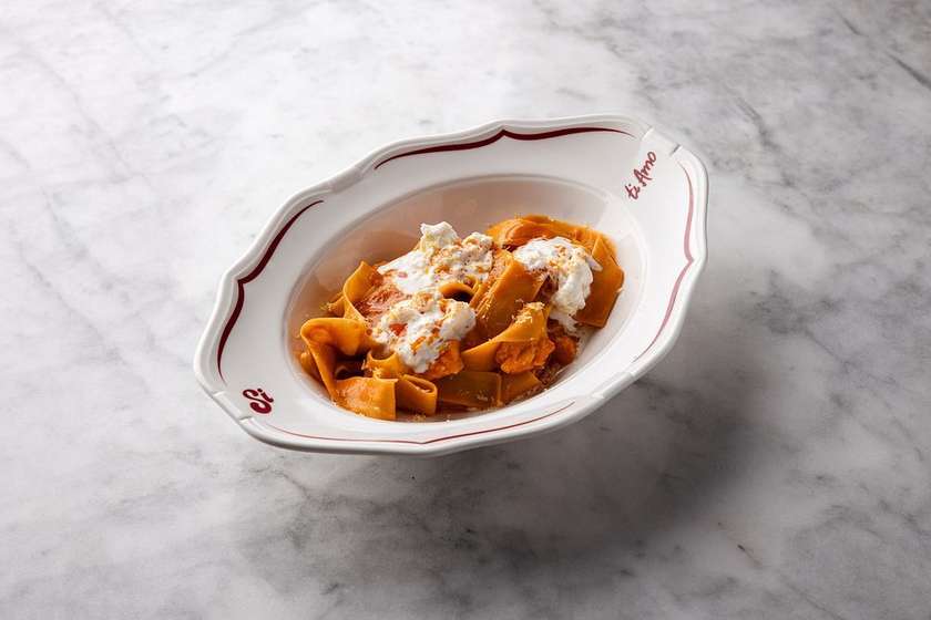 Tagliatelle with trout, bisque sauce and stracciatella