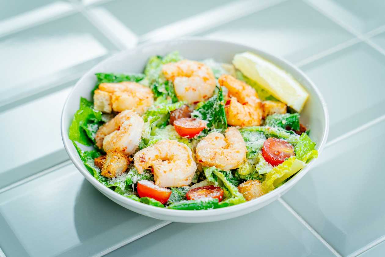 Caesar salad with tiger prawns