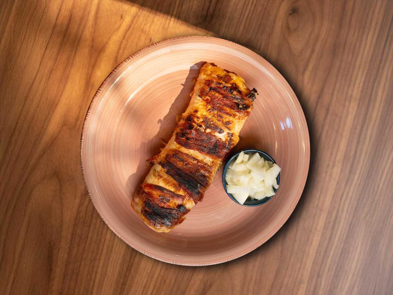 Stuffed chicken with two types of cheese wrapped in pancetta
