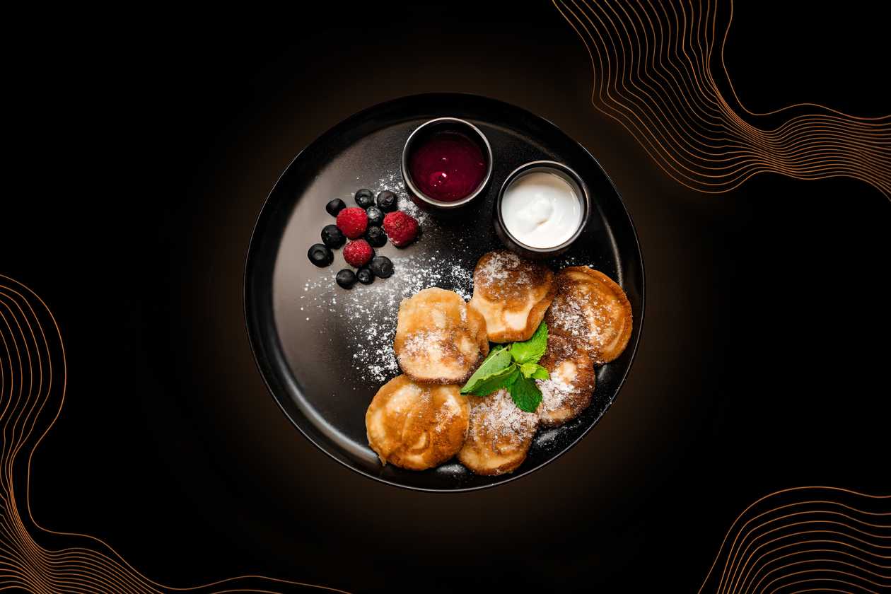 Pancakes with fresh fruit and sour cream