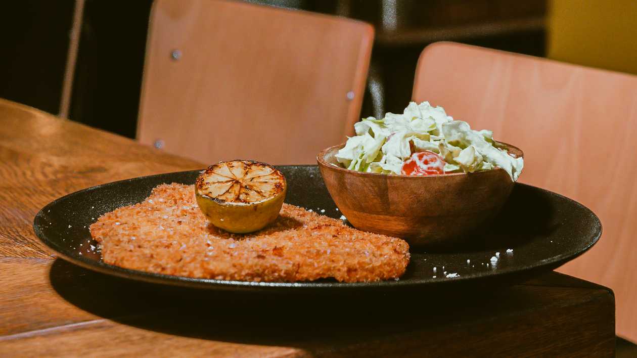 CHICKEN SCHNITZEL W/ AVOCADO SALAD