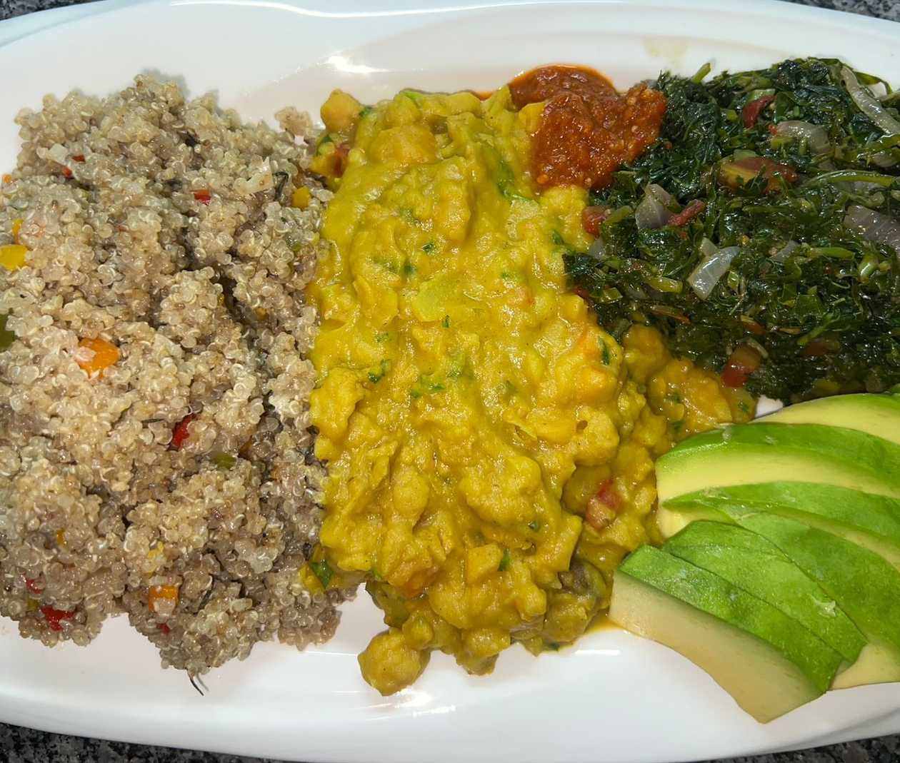 Jamaican Vegetable Quinoa Meal - Curry Chickpeas , Callaloo Greens and Avocado
