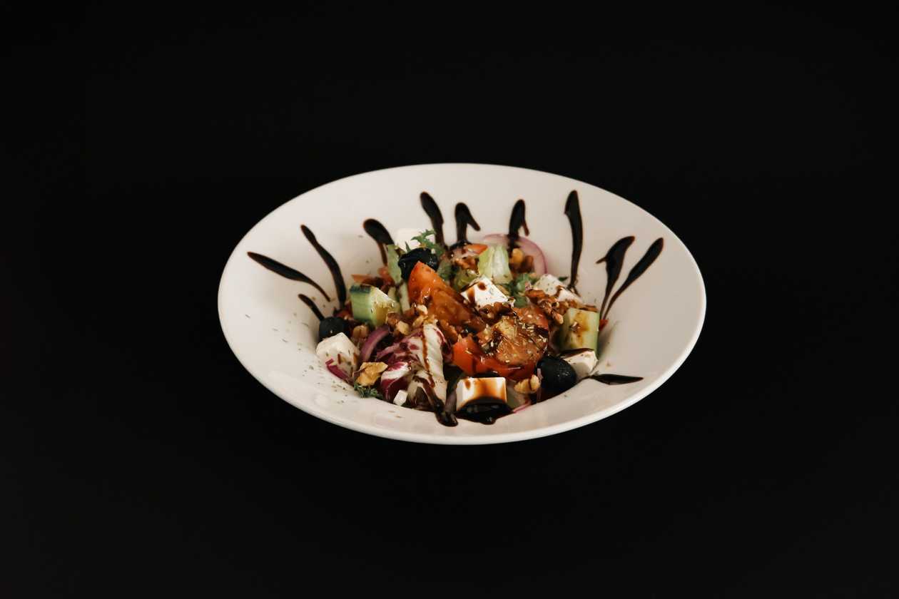 Greek salad with walnuts, fitaki cheese and olives