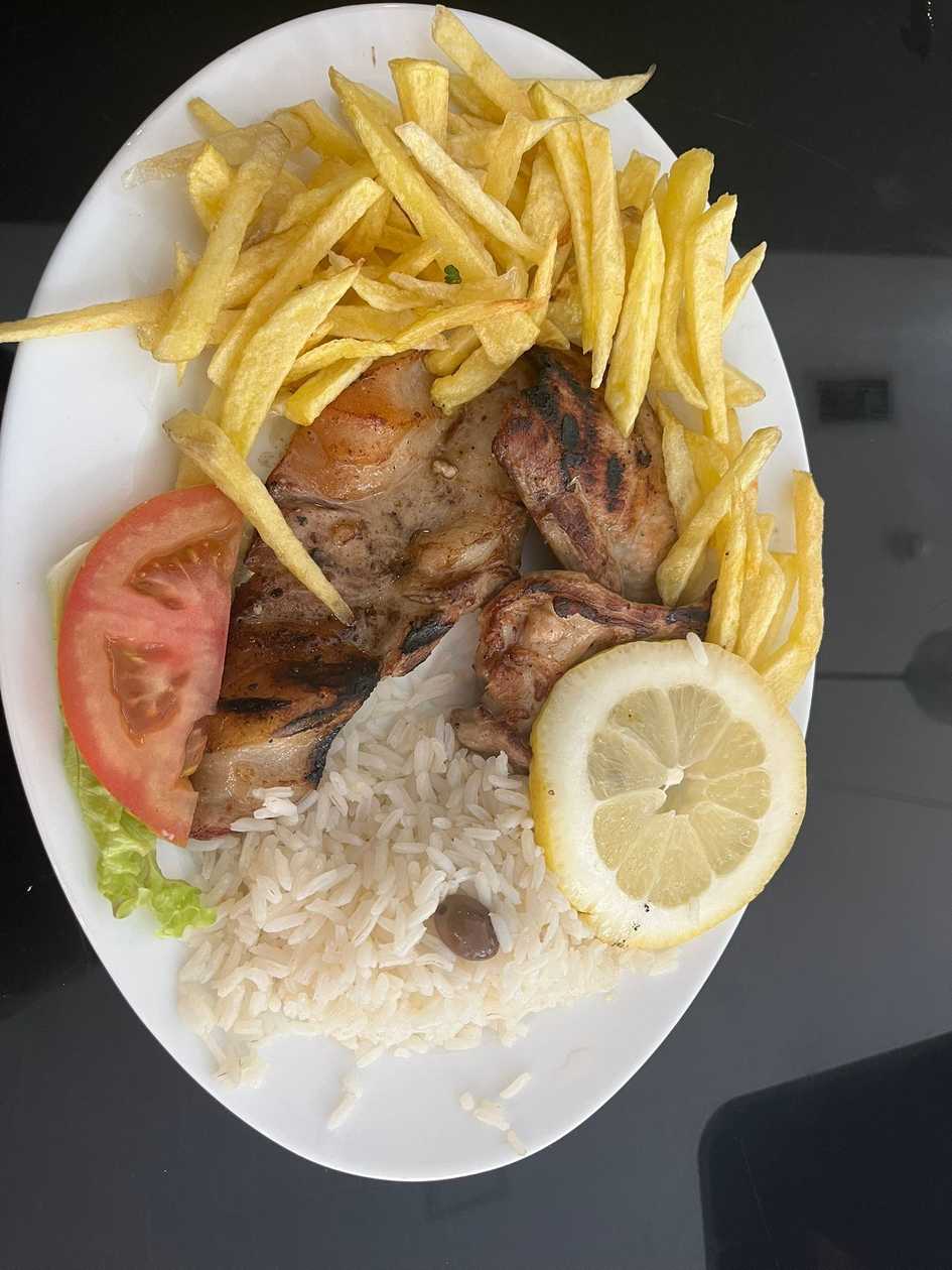 Secret Pork Steaks on the Grill with Rice and Fried Potatoes