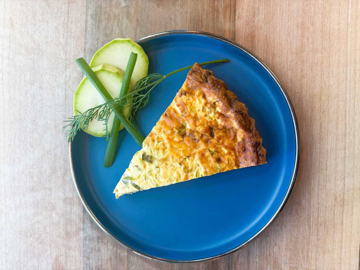 Zucchini and Dill Quiche sliced ​​in almond crust