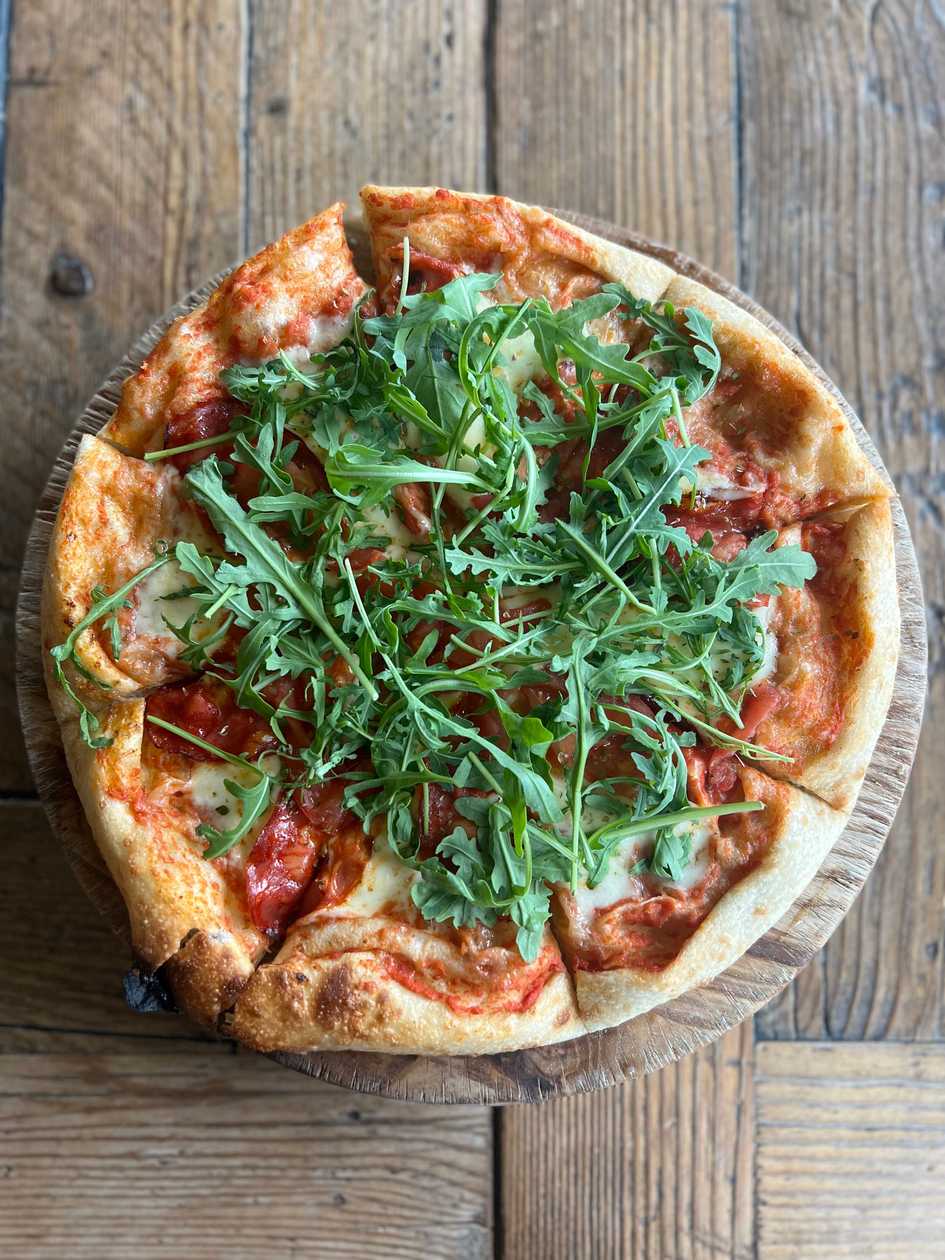 Pizza with chorizo and tomatoes