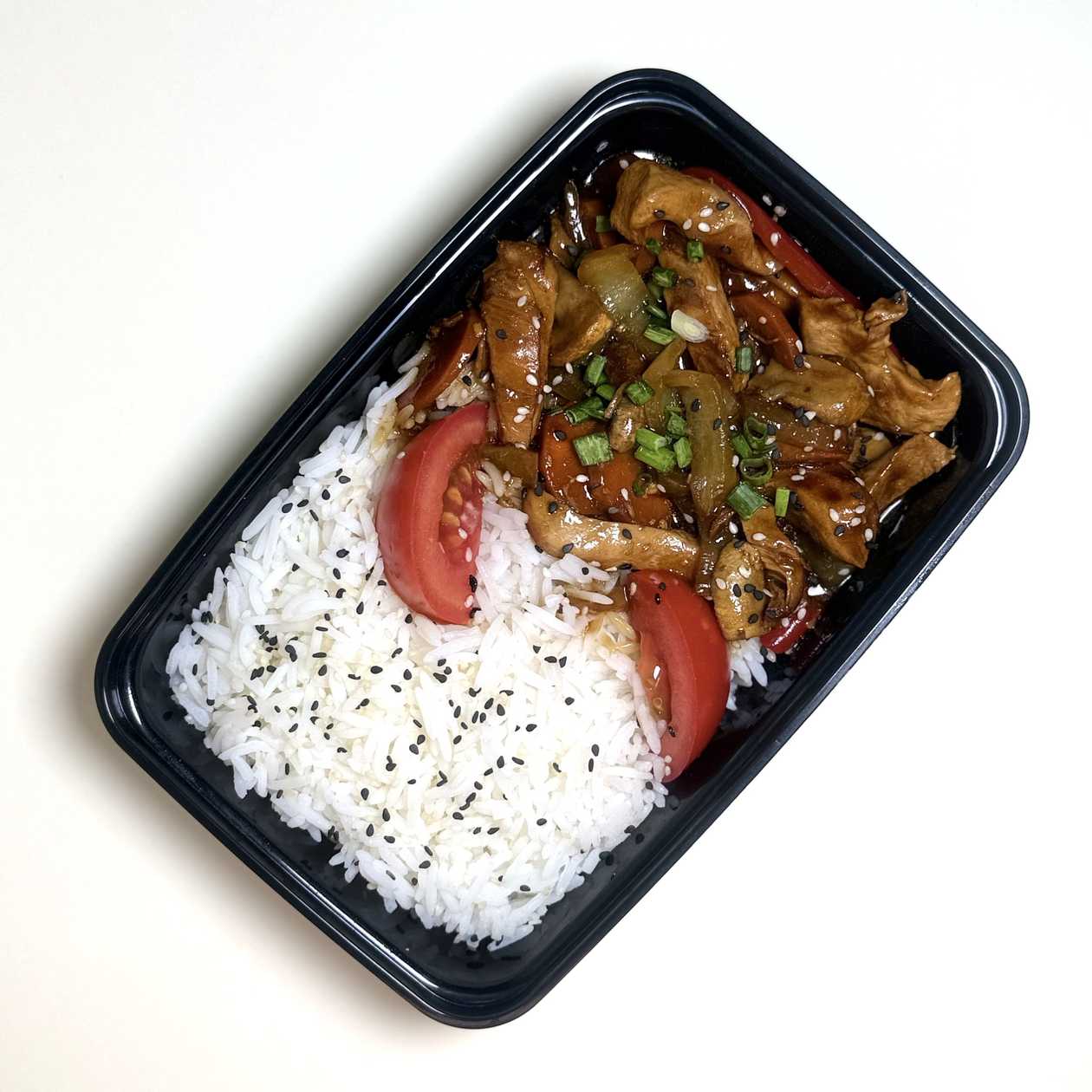 Chicken Asian style with rice garnish