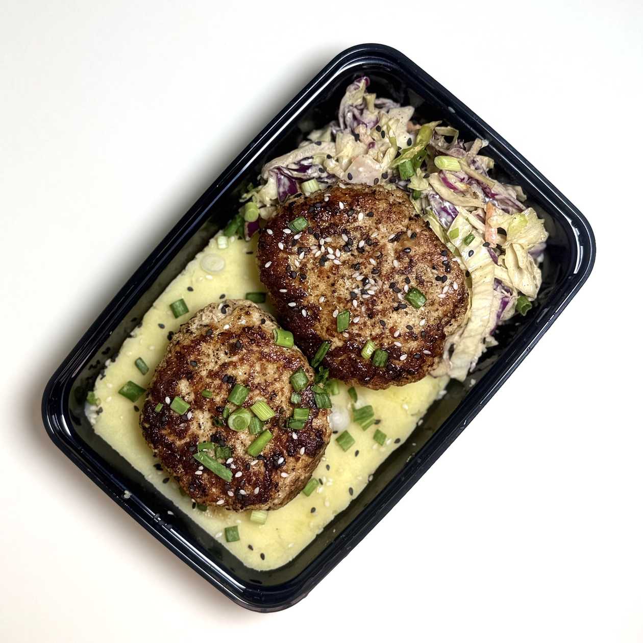 Bruised chicken patties, Coleslaw and mashed potatoes with bread