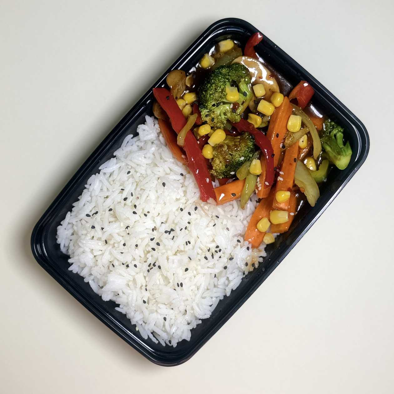 Veggies in sweet and spicy sauce with rice garnish