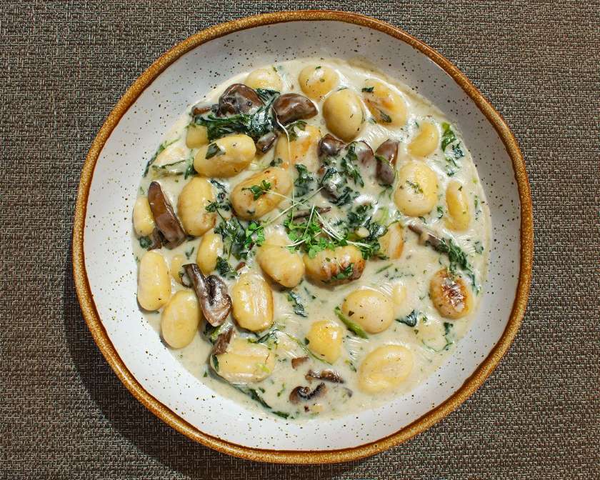 Gnocchi with Spinach, Roquefort Sauce, and Mushrooms