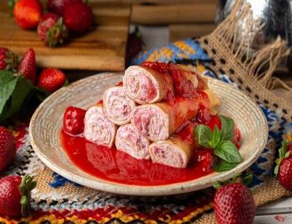 Pancakes with cream cheese and strawberry sauce