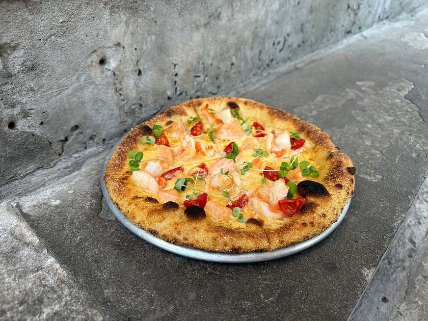 Pizza with tiger shrimp and salmon